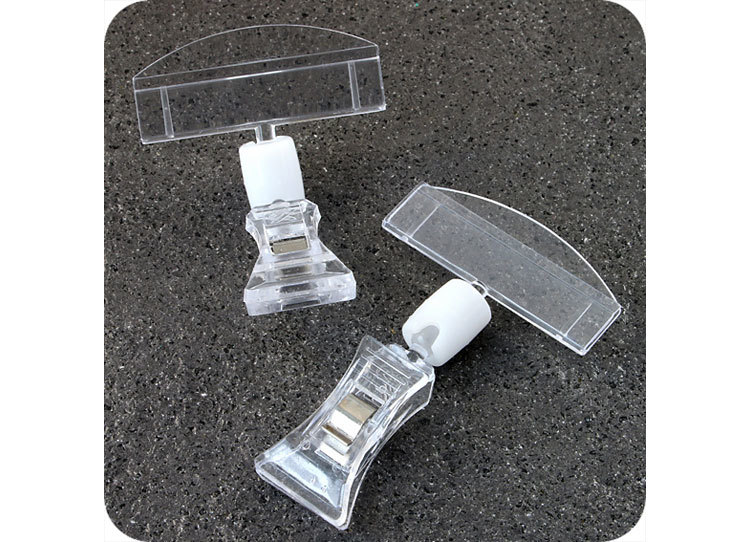 legatoria Doppia molletta Piccola-Portacartellino altezza 85mm TRASPARENTE in policarbonato. Composta da 2 mollette, 1 PICCOLA (38x21mm) e 1 PORTACARTELLINO (50x15mm) collegate da giunto a sfera. Altezza totale 78mm leg2697