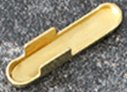 legatoria Capicorda a -T- per elastico o cordoncino OTTONATO, lunghezza 14,3mm. Larghezza 3,2mm. Spessore 3,5mm. Per elastico di spessore fino a 3mm. LEG2896