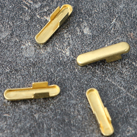 legatoria Capicorda a -T- per elastico o cordoncino OTTONATO, lunghezza 14,3mm. Larghezza 3,2mm. Spessore 3,5mm. Per elastico di spessore fino a 3mm..