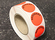 legatoria Bollini autoadesivi in tessuto con testo - Reduziert ROSSO FLUORESCENTE, diametro 30mm, adesivo permanente, in rotolo LEG3388