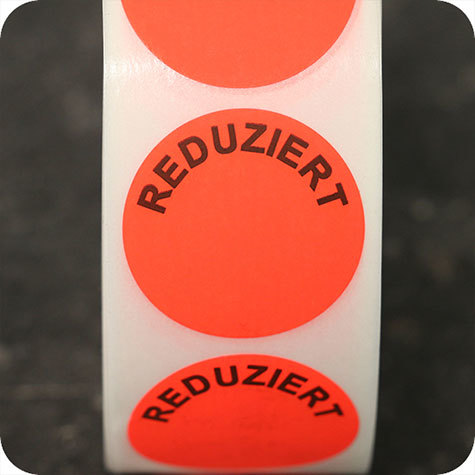 legatoria Bollini autoadesivi in tessuto con testo - Reduziert ROSSO FLUORESCENTE, diametro 30mm, adesivo permanente, in rotolo.