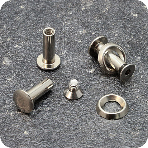 legatoria Viti sepolte con rondella. 12mm NICHELATE, lunghezza 12 mm, testa diametro 10mm, tubetto diametro 5mm, una testa fissa ed una mobile. Per lunghezza, si intende la distanza INTERNA tra le due teste. Misure rondella interna: 6mm. Esterna: 13mm .