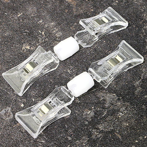 legatoria Doppia molletta Piccola-Piccola altezza 98mm TRASPARENTE in policarbonato. Composta da: 2 mollette PICCOLE (38x21mm) collegate da giunto a sfera. Altezza totale 98mm.