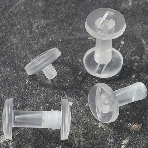 legatoria Vite sepolta rilegatura TRASPARENTE 15mm lunghezza mm 15, diametro testa 12mm, lunghezza mm , diametro tubetto 5mm, una testa fissa ed una mobile, LVI6103. Per lunghezza, si intende la distanza INTERNA tra le due teste, che corrisponde allo spessore del volume da rilegare.