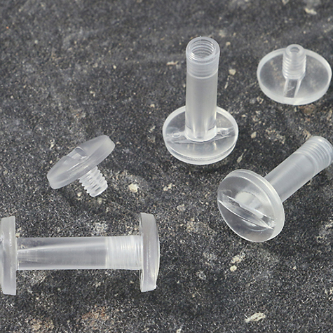 legatoria Vite sepolta rilegatura TRASPARENTE 20mm lunghezza mm 20, diametro testa 12mm, lunghezza mm , diametro tubetto 5mm, una testa fissa ed una mobile, LVI6103. Per lunghezza, si intende la distanza INTERNA tra le due teste, che corrisponde allo spessore del volume da rilegare.