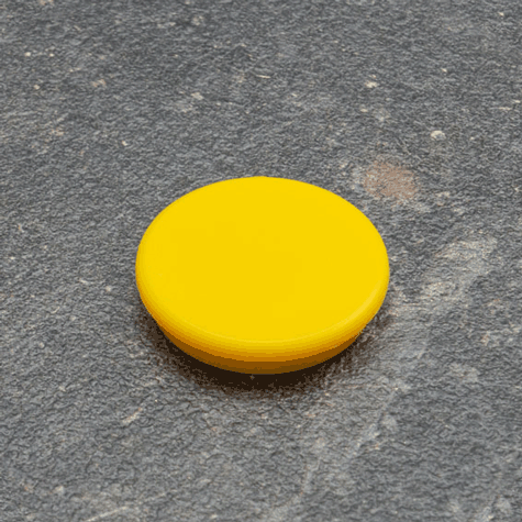 legatoria Calamita tonda GIALLA, diametro 32mm Calamita rettangolare con rivestimento in plastica, GIALLO. Spessore 7mm, dotato di due calamite in ferrite poste sulla superficie inferiore. Forza adesiva 800gr..