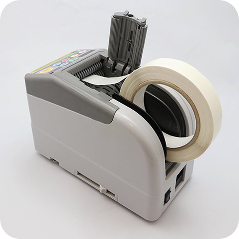 legatoria Dispenser elettronico, nastri adesivi  Programmabile. Display digitale. Cassetto di apertura per pulirlo facilmente. Monta 2 rotoli di nastro contemporaneamente. Utilizzabile per nastri mono e bi-adesivi larghi da 6 a 60mm. Lunghezze programmabili da 5 a 999mm.