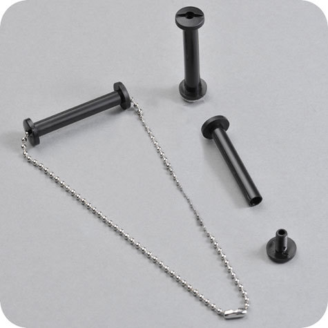 legatoria Viti sepolte forate NERE 30mm  lunghezza 30 mm, diametro testa 12mm, diametro tubetto 6mm, foro interno 3mm, una testa fissa ed una mobile. Per lunghezza, si intende la distanza INTERNA tra le due teste, che corrisponde allo spessore del volume da rilegare.