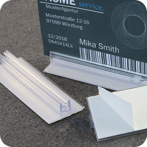 legatoria Porta cartellino autoadesivo 75x25mm TRASPARENTE, angolo di 90 gradi. Con base autoadesiva in schiuma di polietilene.