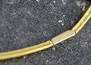 legatoria Anello elastico rivestito tessuto, 293mm ORO, spessore 2mm, le due estremit sono congiunte con una chiusura metallica per formare un anello che ben si adatta a rilegare fogli formato A6 (14,85mm) LEG4006