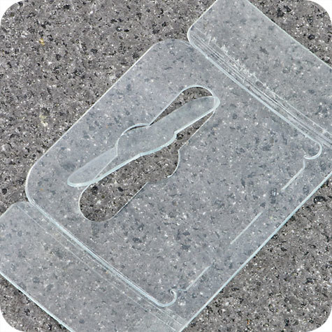 legatoria Appendini trasparenti autoadesivi per blister 62x35mm foratura standard europea piegevole, in PET da 400micron, con due superfici adesive, per oggetti fino a 400 grammi. In rotolo.