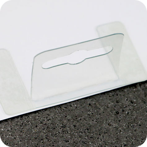 legatoria Appendini trasparenti autoadesivi per blister 62x35mm foratura standard europea piegevole, in PET da 400micron, con due superfici adesive, per oggetti fino a 400 grammi. In rotolo.