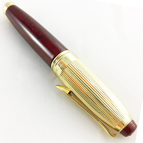 gbc Penna stilografica mini OSAMA BORDO'-ORO Pennino Iridium Point Germany originale. Fusto in resina acrilica, placcata in oro. Da collezione, Dimensioni: 15x100mm. completa di astuccio.