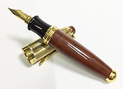 gbc Penna stilografica mini OSAMA BRUNO/ORO Pennino Iridium Point Germany originale. Fusto in resina acrilica, placcata in oro. Da collezione, Dimensioni: 15x100mm. completa di astuccio.