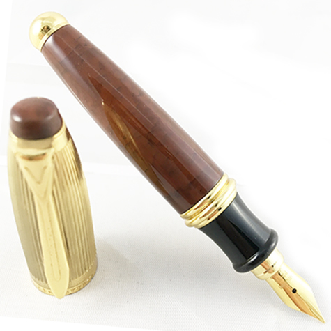 gbc Penna stilografica mini OSAMA BRUNO-ORO Pennino Iridium Point Germany originale. Fusto in resina acrilica, placcata in oro. Da collezione, Dimensioni: 15x100mm. completa di astuccio.