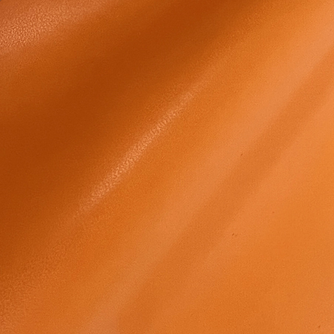 legatoria EcopelleTintaUnita VenaturaLeggera, 1016 ARANCIO  in rotoli altezza 50cm, 230gr-mq per rilegatura, legatoria, cartonaggio .